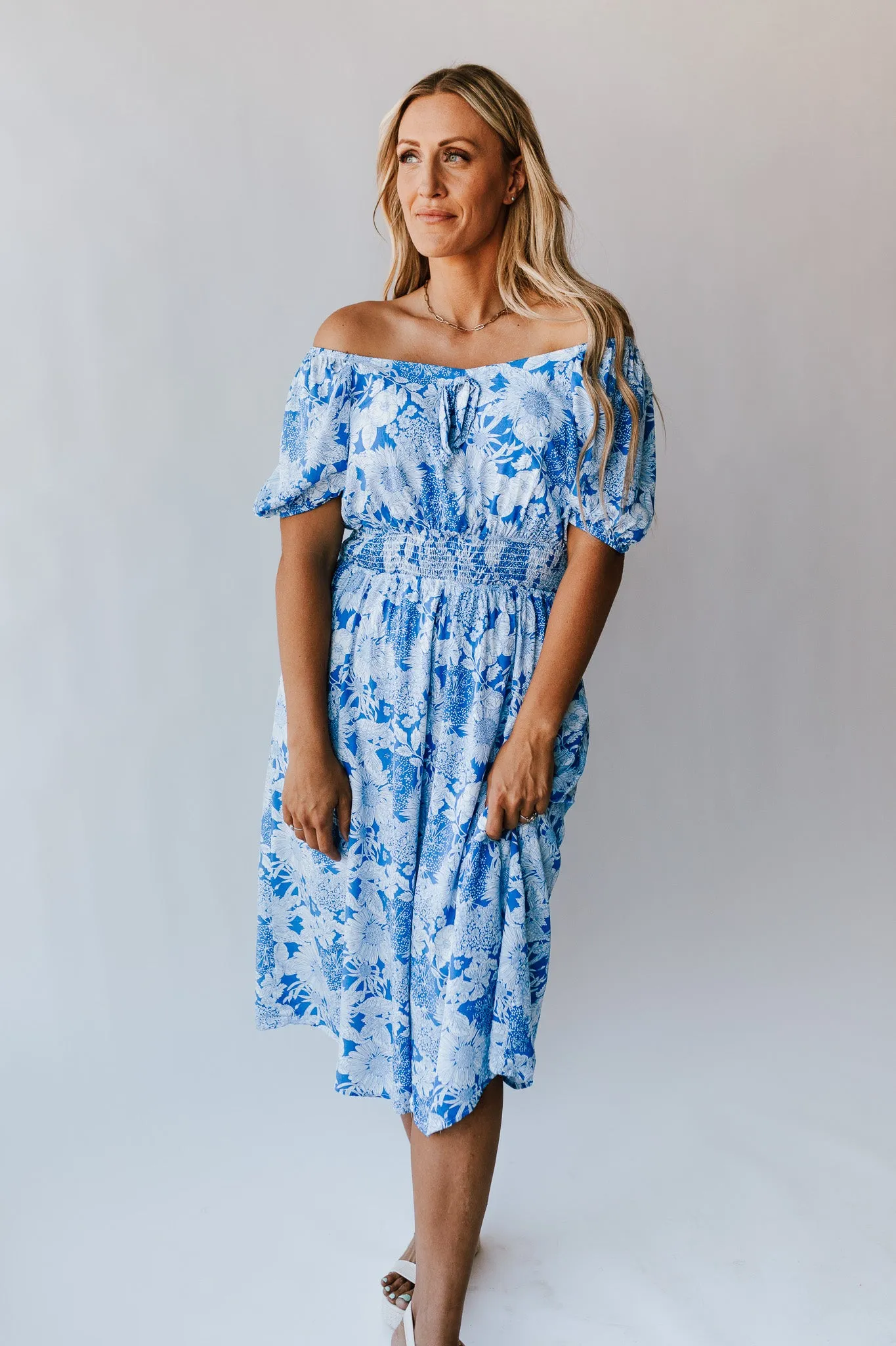 The Challis Smocked Detail Dress in Blue Floral